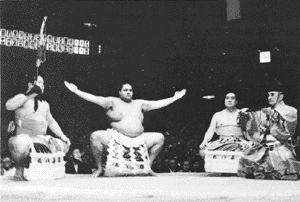 Yokozuna Akebono performing ancient ceremony 
wearing a heavy hemp belt