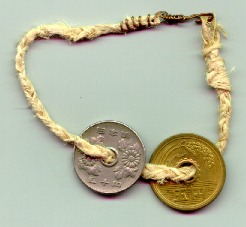 5 and 50 yen coins 
on a hemp string